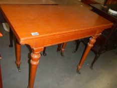 A Edwardian blond mahogany tea/card table. COLLECT ONLY.