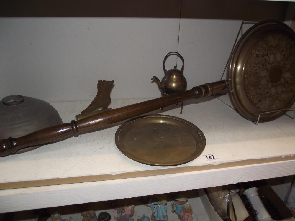 A brass and copperware including warming pan, Lady Godiva tray etc
