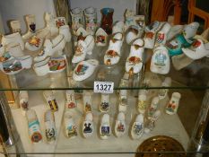 A good mixed lot of porcelain shoes including crested examples.