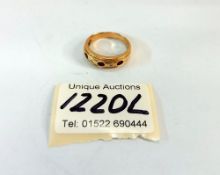An 18ct gold ring with gems (total weight 4.95gm)