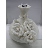 A good 20th century white ceramic vase with applied chrysanthemums.