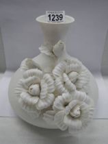 A good 20th century white ceramic vase with applied chrysanthemums.