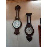 Two Edwardian aneroid oak barometers.