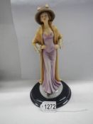 A 1930's style figure of a lady.