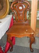 A 19th century carved oak hall chair, COLLECT ONLY.
