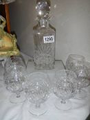 A mid 20th century cut glass decanter with six glasses. COLLECT ONLY.