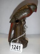 A bronze posy vase in the form of a parrot.