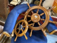 Two wooden ships / boat wheels