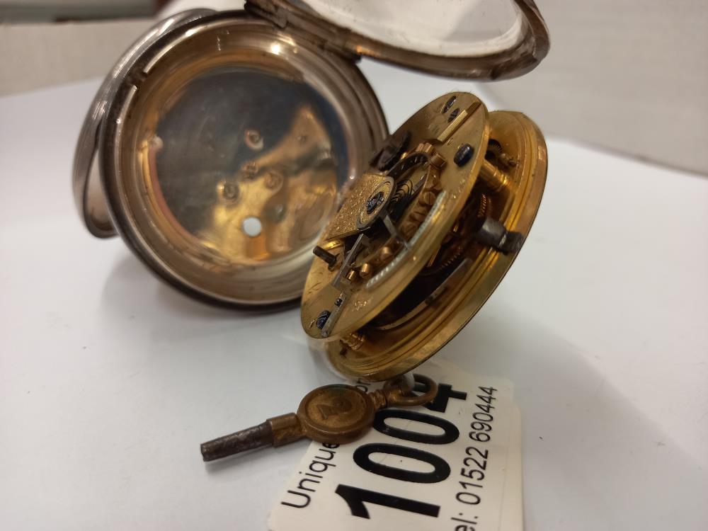 A silver pocket watch with key, dial cracked and not working. - Image 4 of 6