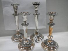 Two good pairs of Sheffield plate candlesticks.