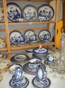 In access of 50 pieces of Old Willow blue and white tea and dinner ware, various makers, COLLECT