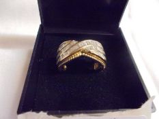A 1.5 ct diamond princess and channel cut diamond ring, size O, 5.45 grams.