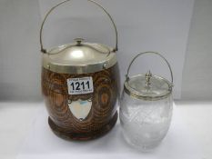 A glass biscuit barrel engraved Merry Christmas/Happy New Year and an oak biscuit barrel.