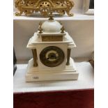 A white painted slate mantel clock