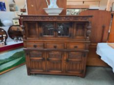 A 1930's oak buffet with lead glazed doors, COLLECT ONLY.