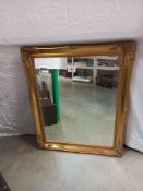 A guilt framed bevel edge mirror