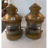 A pair of ships lamps with burners