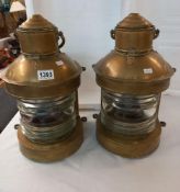 A pair of ships lamps with burners
