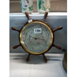 A barometer in the form of a ships wheel