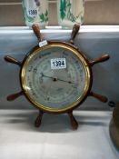 A barometer in the form of a ships wheel