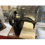 A 19th Century Willcox and Giles Silent Sewing Machine with original price list