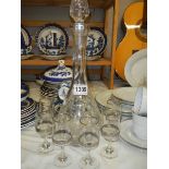 A tall cut glass decanter and six glasses. COLLECT ONLY.