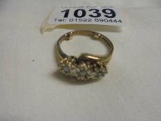 A three stome diamond yellow gold ring, size O half, 3.27 grams.