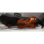 A violin with bow and case