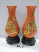 A pair of 20th century Chinese style lacquered vases.