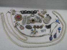 A good tray of costume jewellery including necklaces, brooches etc.,