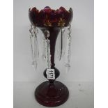 A Victorian ruby glass lustre with clear glass droppers, COLLECT ONLY.