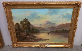 A gilt framed oil on canvas Lake scene signed 62 x 87 cm