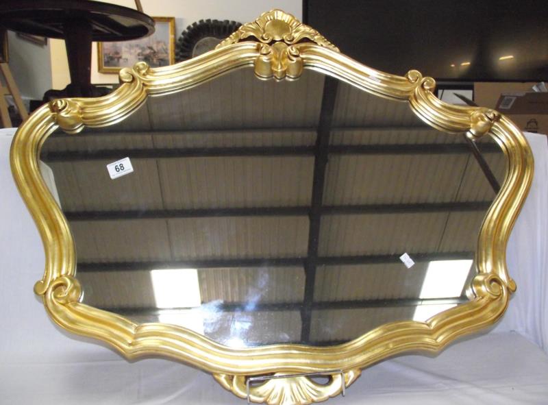 An ornate gilt ormalu framed mirror COLLECT ONLY