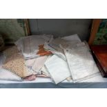 A large quantity of vintage textiles including household linen embroidered & lace, trimmed cloths,