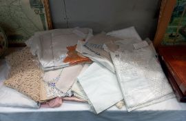 A large quantity of vintage textiles including household linen embroidered & lace, trimmed cloths,