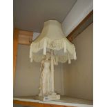 An art deco plaster female figural table lap marked Tuscan.