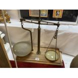 A 19th / 20th Century brass balance scales on oak base