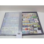 A large stamp album with mostly complete pages of world stamps.