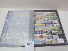 A large stamp album with mostly complete pages of world stamps.