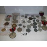 A mixed lot of old coins, medals etc.,
