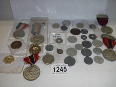 A mixed lot of old coins, medals etc.,