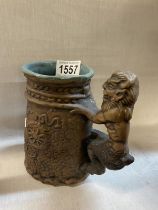 A vintage 1971 Jim Rumph studio pottery tankard with Satyr handle with nude maiden inside