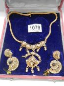 A good cased 20th century gilded necklace and earrings.