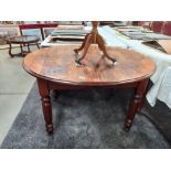 A Victorian oval mahogany dining table. COLLECT ONLY.
