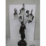 A tall figural three light table lamp, COLLECT ONLY.