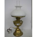 An old brass oil lamp complete with shade. COLLECT ONLY.