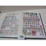 A stamp album with several complete pages of world stamps.