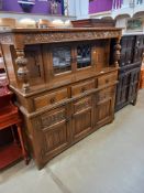 A 1930's solid oak buffet with lead glazed doors. COLLECT ONLY.