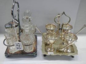 A silver plate condiment set and a silver plate egg cup set.