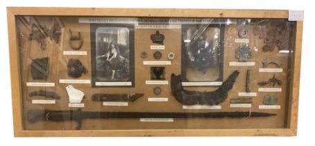 A framed WW1 display of Relics From a German Line Trench from Ypres Salient